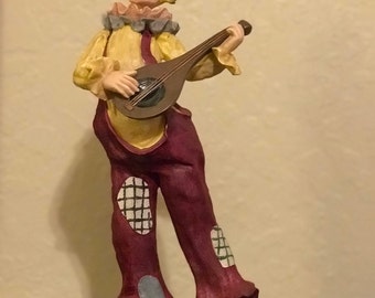 Clown Figure playing Mandolin