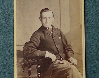Carte-de-visite, antique. Featuring a serious seated young man. Israel Todd, Otley, (W. Yorks). c 1890's.