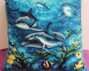 Navy bottoms cushion dolphin and fish pattern