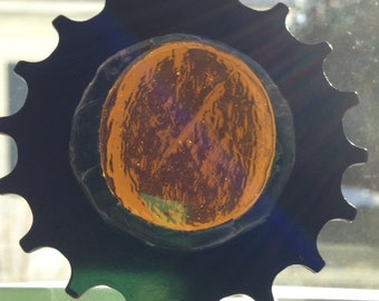 Bicycle Art: Stained glass, repurposed bike sprocket in warm gold tones