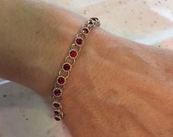 Avon bracelet with red stones