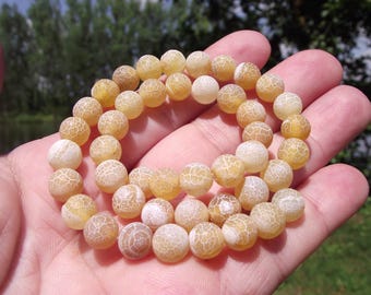 6 FIRE DRAGON VEINS AGATE 8MM BEADS. (YELLOW).