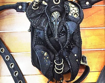 black hip bag with bird skull