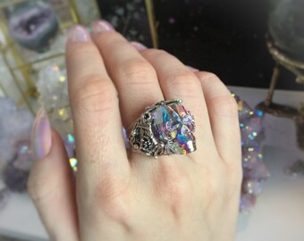 Aura Crystal Skull ring, made using Swarovski AB crystal skull, adjustable brass band