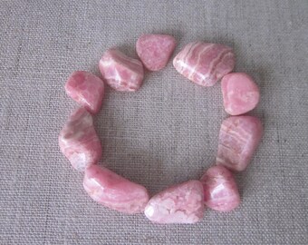 Ten Rhodocrosite Tumbled Stones & Velvet Bag