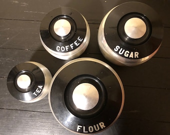 Vintage Kromex Brushed Aluminum Canister Set with Black Plastic Lids