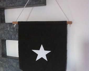 Banner made of thick canvas with star and writing