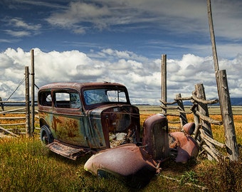 Abandoned Rusty Auto Sedan Wreck in a Grassy Field by a decrepit Corral Fence out West No.6672 A Fine Art Auto Landscape Photo