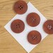 Pack of 8 wooden buttons, warm brown, 25mm diameter