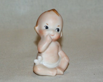 I'm a sweety-pie porcelain Kewpie doll