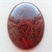 Analcimolite oval form cabochon