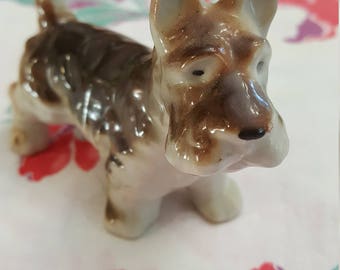 Vintage made in Japan Scottish Terrier with brown and grey coat tail held high