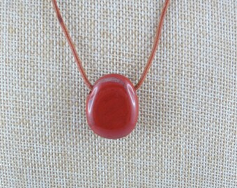 Red cord with Jasper pendant.