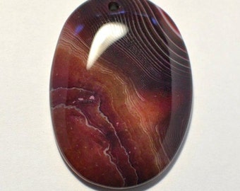 Natural Striped Agate pendant oval shape brown-red color. 47x34x7 mm