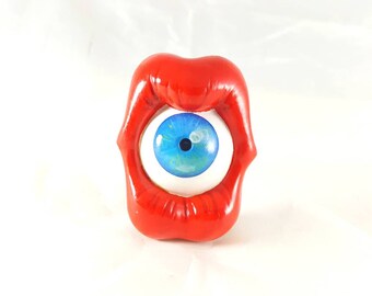 Mouth and eye blue lapel pin