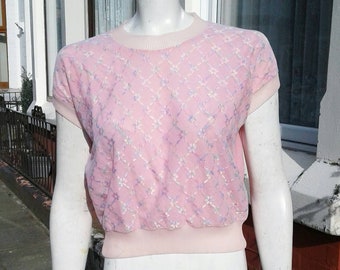 Cute late 1950s 60s pale pink top with pleating to cuffs and neckline and glittery sparkly lace to front