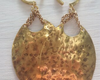 antiqued hammered brass weights for stretched lobes. shiny brass coils with chains.