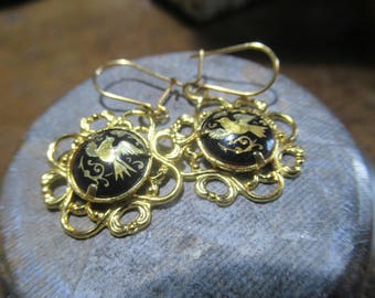 Vintage delicate and dainty dangle Damascene Bird earrings.