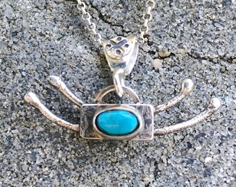 Turquoise, sterling silver necklace. Southwest design.