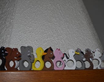 With painted wood animal napkin rings