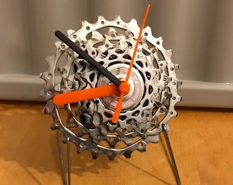 Cycle freestanding clock made from recycled bike parts.