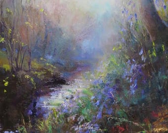 Blue bells by stream in evening light