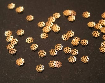 Set of 300 gold metal caps. (ref:0122).