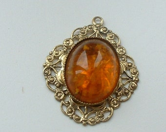 Filigree metal amber glass pendant