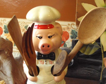 Pig chef with his utensils from the 70s.