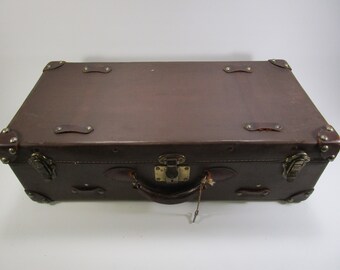Vintage leather luggage suitcase with key