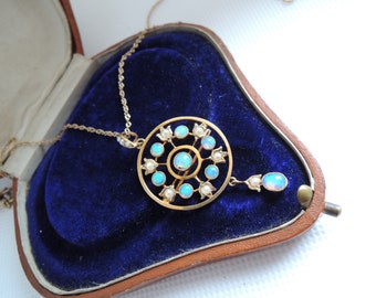 An Art Nouveau Opal and Seed Pearl Gold Brooch Pendant with Chain