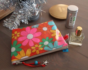 Small cosmetic travel bag in red laminated cotton vintage floral patterned