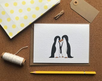 Penguins in love greetings card