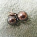 11mm black pearls earrings fancy backs.