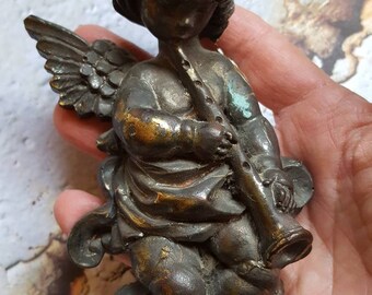 Tattered angel chipped assemblage supplies disrepair