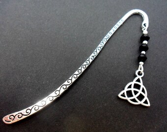 A tibetan silver and black crystal bead celtic knot charm bookmark.