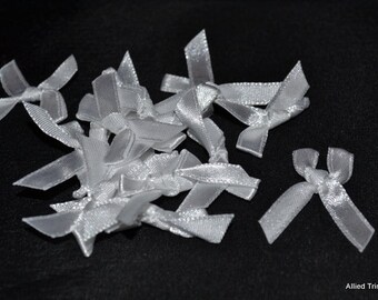 100 x White Bra Bows in Polyester