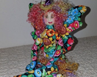 Whimsical, fiber sculpted flower fairy, silk face, Swarovski crystal accents