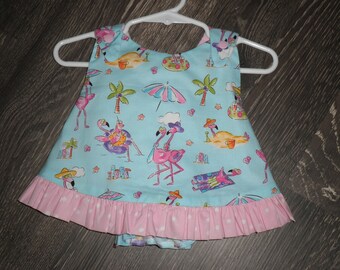 ruffled pinafore dress with matching bloomers for baby.