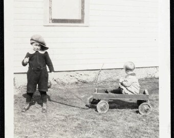 vintage photo Boy in Dads Cap Baby in Wagon by House