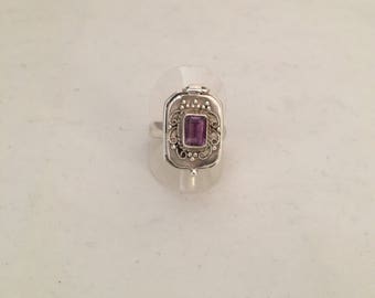 Topped with a stone Amethyst poison ring