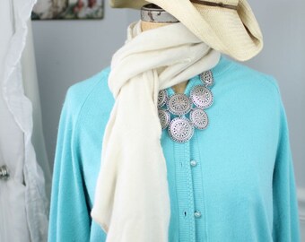 Lush, hand-crocheted scarves made from repurposed cashmere sweaters (in white)