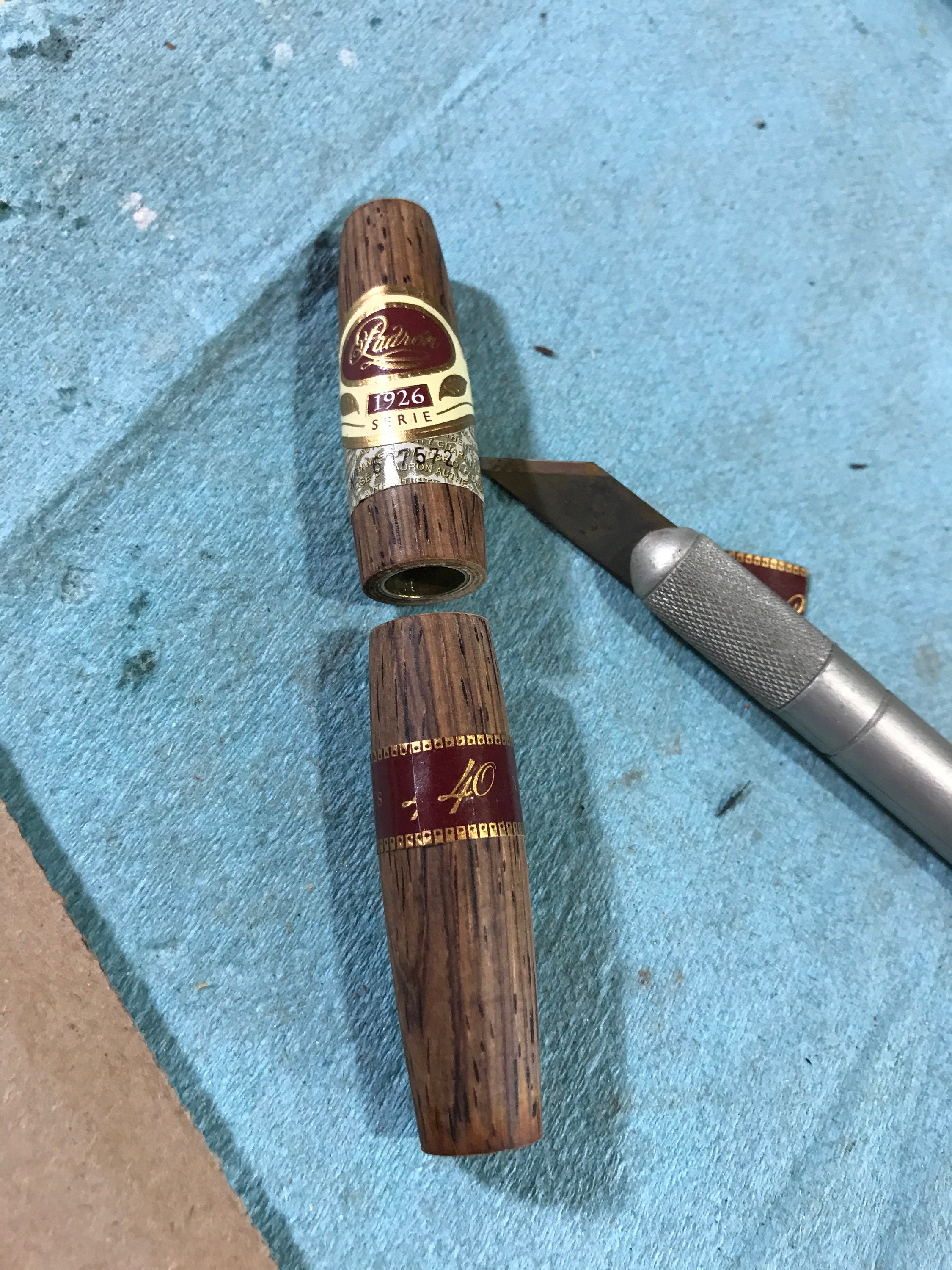 Just after applying the three cigar bands to the pen barrels