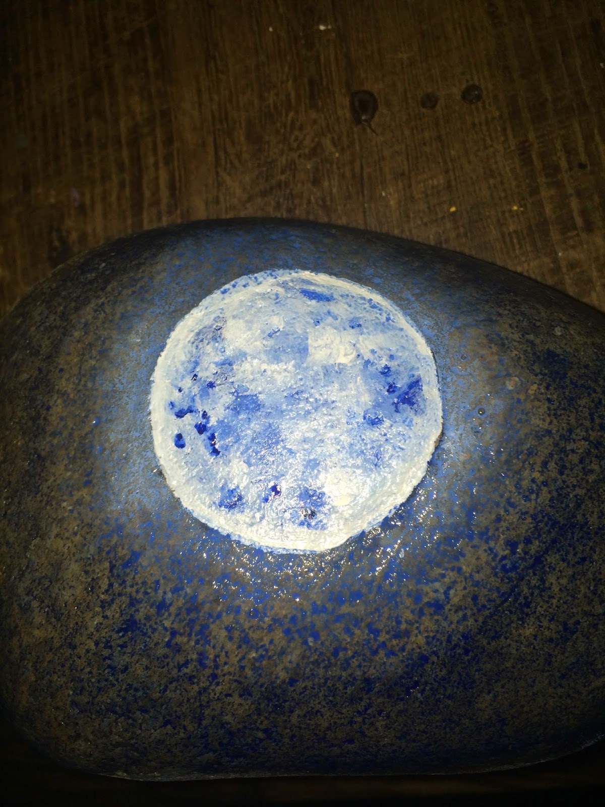Moon glow effect painted around the moon on the stone