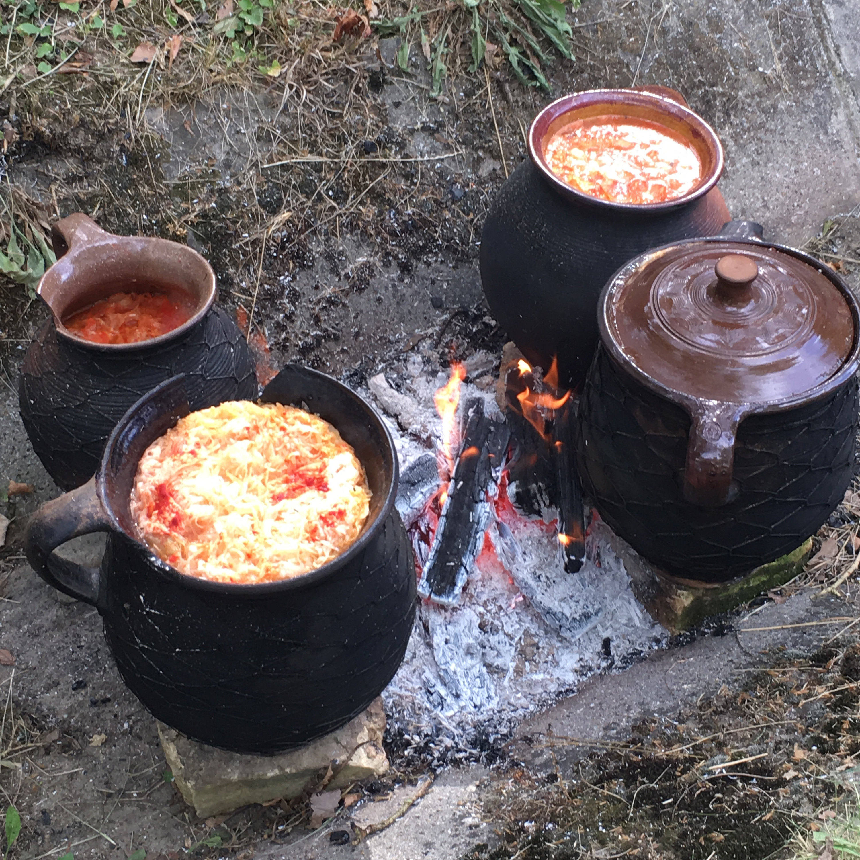 Goulash and beans being made in clay pots for the Hungarian washing festival