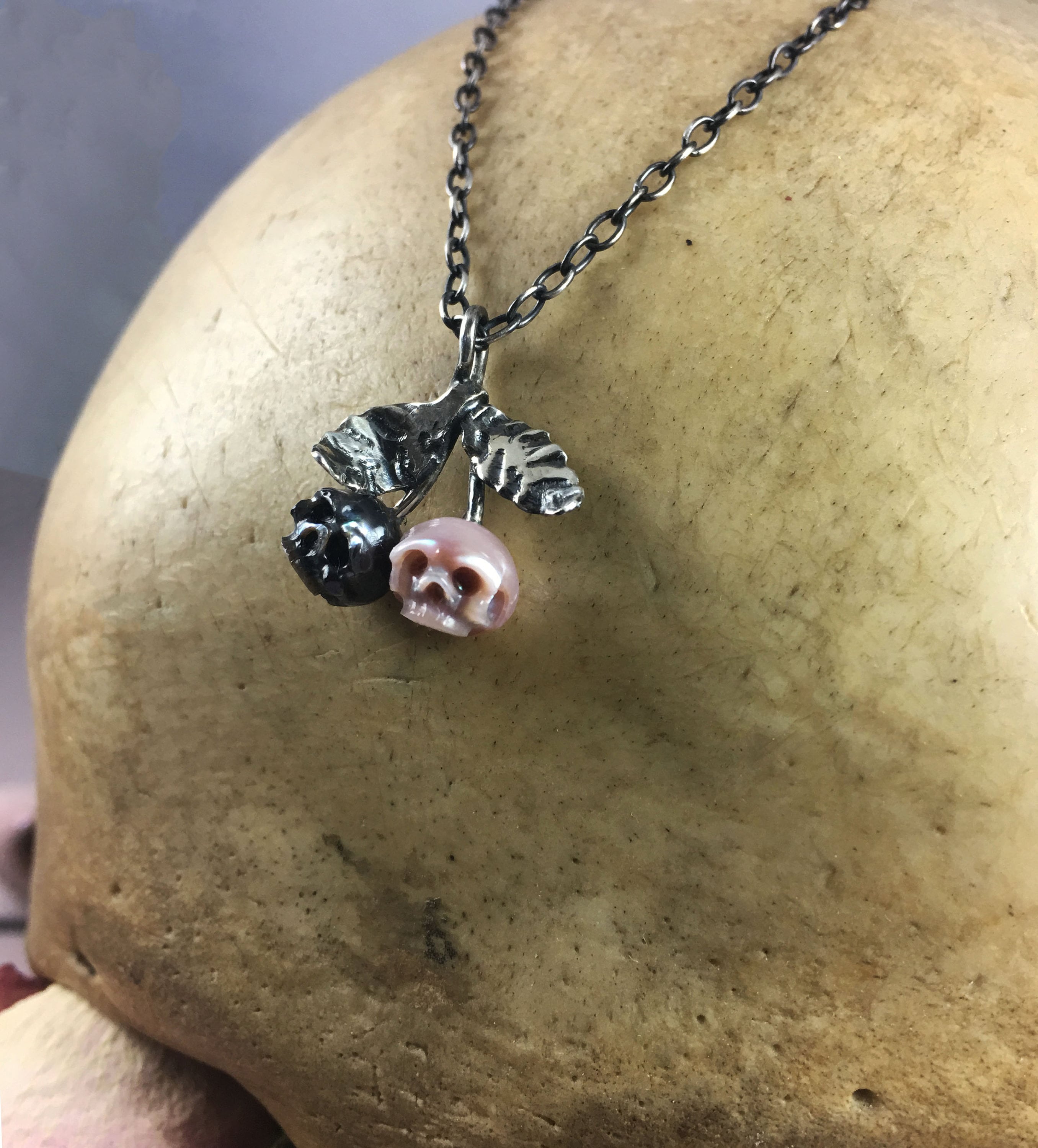 Hand Carved Pearl Skull Cherry Necklace