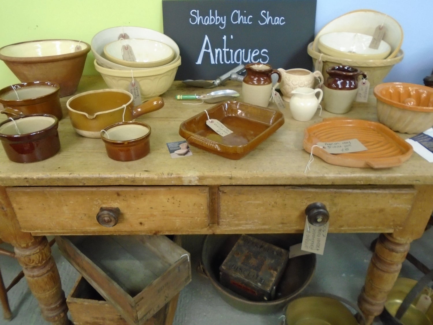 Farmhouse kitchen table laden with French vintage stoneware