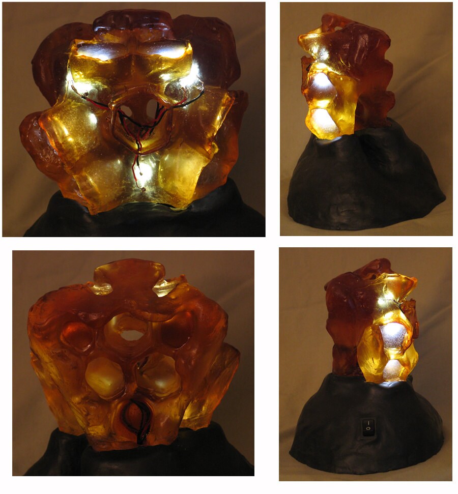 Translucent amber honeycomb with embedded LEDs . Apis habilis: Honeycomb Number 4