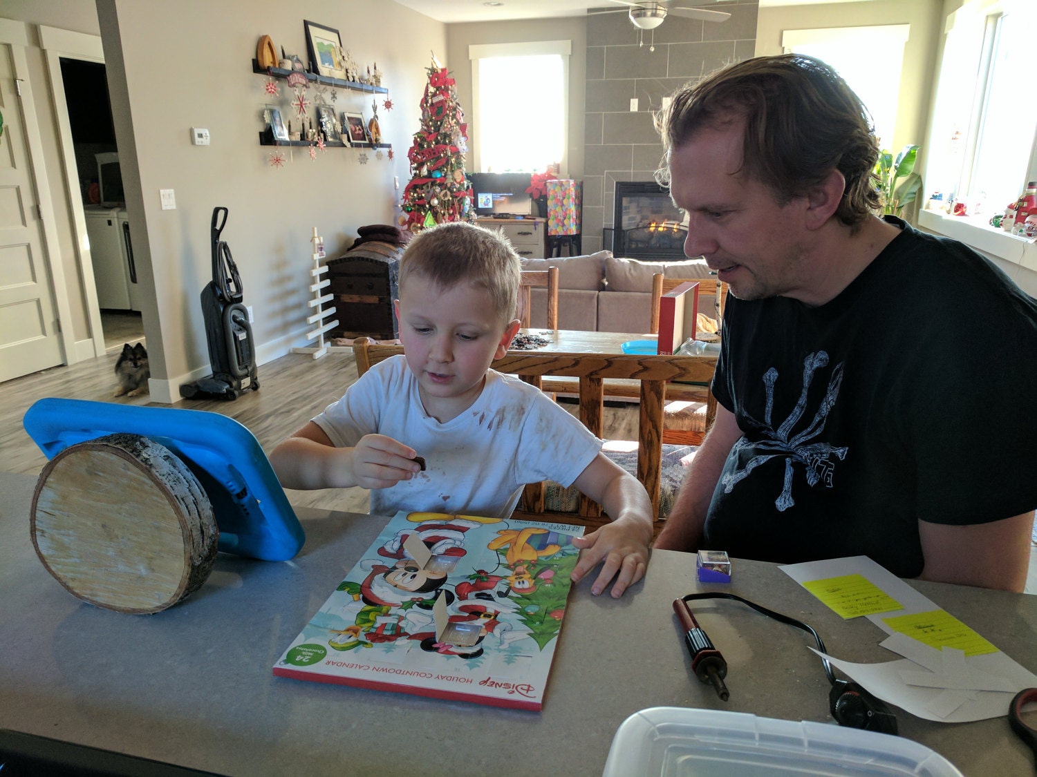 Advent calendar fun. Notice the birch slab acting as a tablet holder.