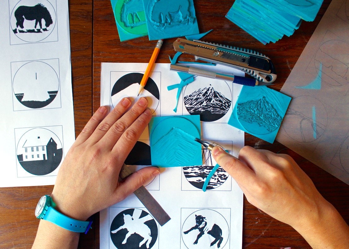 Artist Ben Craig by Boat and Balloon cutting linostamps